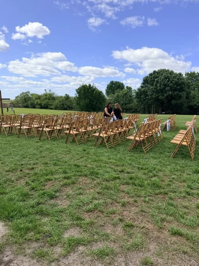 A bride and wedding party at an outdoor destination ceremony